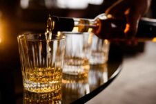 barman-filling-glass-alcohol-compressed